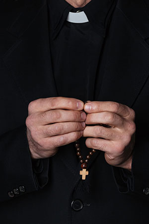 Hands of catholic priest